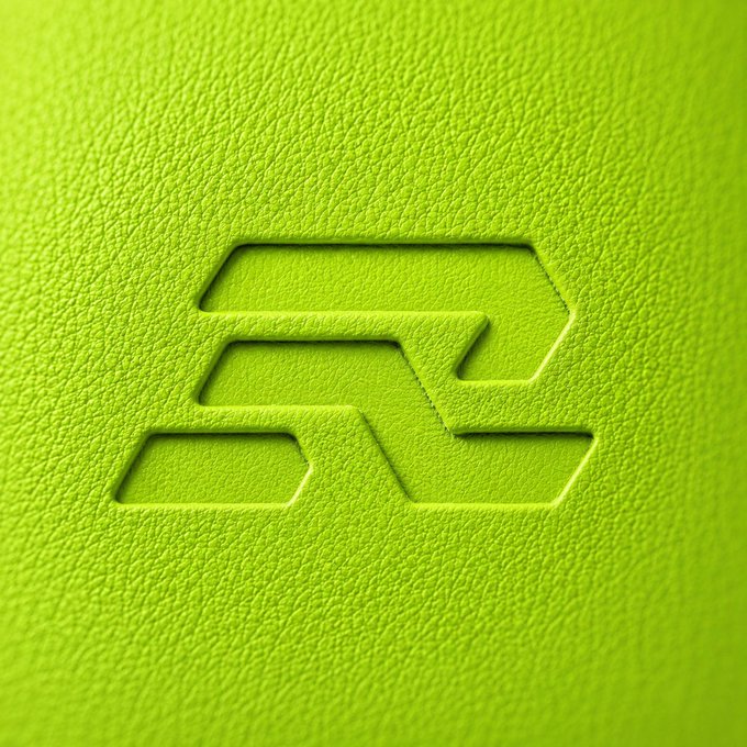 The image features a close-up of a green surface with a logo that reads "R2" or "solana", which could be interpreted as either "second" or "solana". The background appears to be a light green color, possibly representing the interior design theme of the space where the logo is displayed.

The image also contains text that says "SOLANA IS HOME. gRaiku to those who still graiku", which could be an advertisement for Solana or another related business. The combination of the logo and text creates a sense of branding and identity, suggesting that the space may be associated with a particular company or organization.