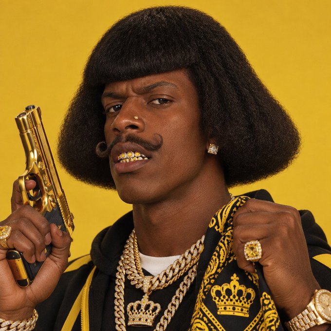 A stylized portrait shows a man with a large afro and mustache holding a gold pistol against a yellow background, wearing gold grills, diamond earrings, multiple gold chains, and rings while wearing a black and gold patterned jacket.