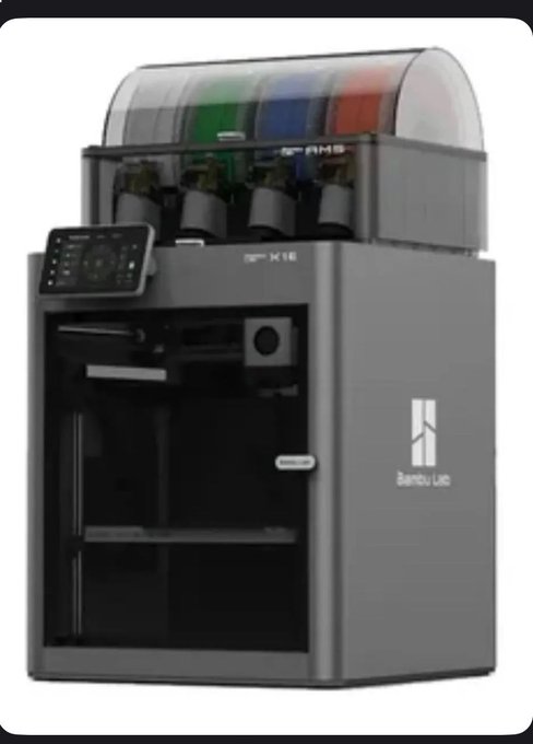 A Bambu Lab 3D printer, specifically the AMS model, featuring a multi-color filament system on top and a single enclosed printing unit below.