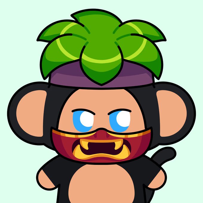 A cartoon illustration of a black monkey character with large ears, blue eyes, wearing a green leafy hat and a red and gold mask covering the lower half of its face.