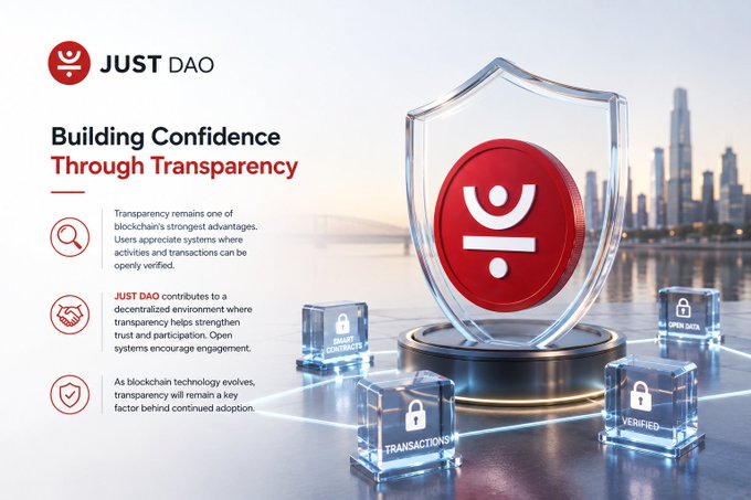 The image promotes JUST DAO with the headline "Building Confidence Through Transparency," featuring a red shield logo and glowing cubes labeled "Smart Contracts," "Transactions," "Verified," and "Open Data" against a city skyline, visually reinforcing the message about blockchain transparency and decentralized trust.