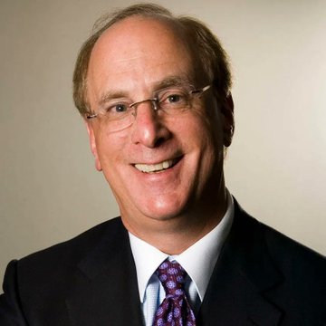 A smiling, balding man in a dark suit and purple patterned tie wearing glasses, likely a financial commentator or analyst, pictured in connection with news of BlackRock and other ETFs purchasing $517.19 million worth of Bitcoin—the largest crypto inflow in over three months.