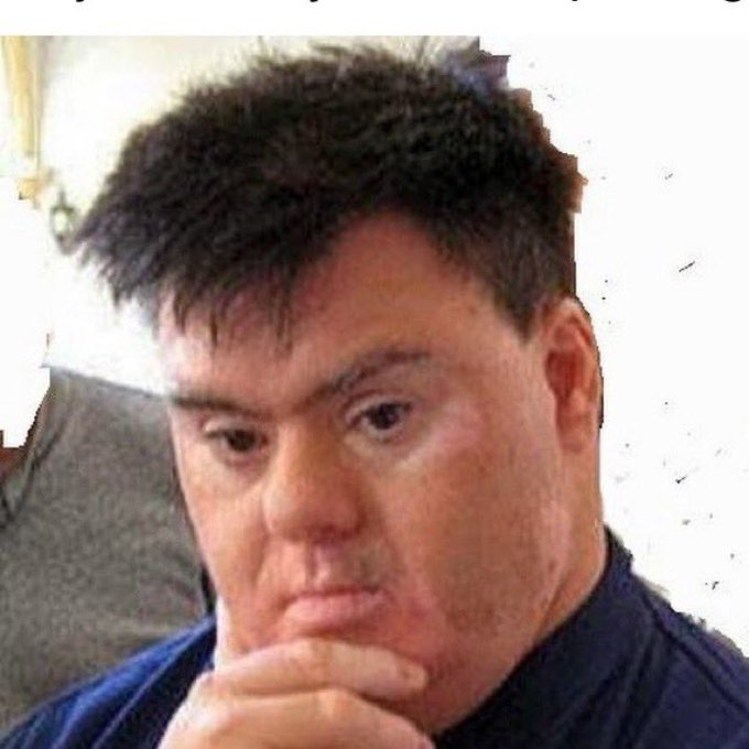 I can't identify the person in the image. I can describe them as a man with short, spiky dark hair, wearing a dark blue shirt, with his hand resting thoughtfully against his chin in a contemplative or skeptical pose. His expression appears to convey doubt or suspicion, which complements the post's critical commentary questioning the legitimacy of low-liquidity crypto trades with inflated market caps.