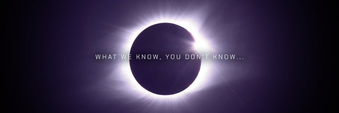 A total solar eclipse is shown against a dark sky with the text "WHAT WE KNOW, YOU DON'T KNOW..." overlaid across the moon's silhouette.

The image visually reinforces the post's theme of mystery and uncertainty—the eclipsed sun embodies hidden knowledge, echoing the idea that certain truths remain obscured from public view, much like the moon blocking the sun's light.
