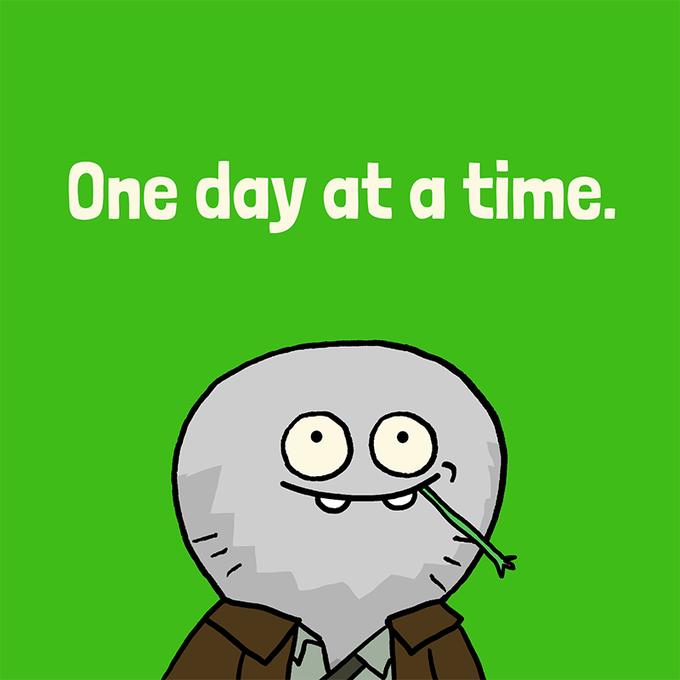 A cartoon illustration on a green background showing a grey, egg-shaped character with a stitched smile and a piece of grass in its mouth, with the text 'One day at a time.' above it.