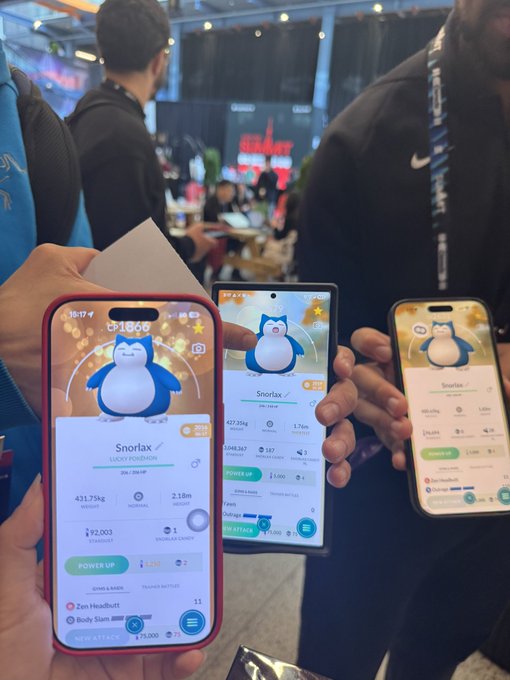 Three hands hold smartphones displaying a mobile game or wallet app with a pink whale mascot called 'SnorlaX'. The screens display stats like '431.75kg', '¥92,003', 'POWER LV. 6', and usernames including 'Zen Headbatt' and 'BODY SLAM'.