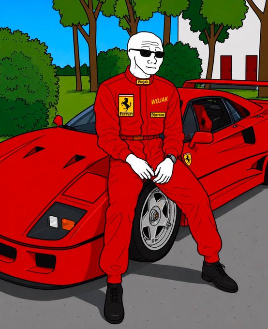 A Wojak cartoon character sits on a red Ferrari F40, dressed in a red Ferrari racing suit featuring "WOJAK," "F40," and "Ferrari" sponsor patches, paired with the caption "gm $wojak crew" as a greeting to fellow Wojak fans.