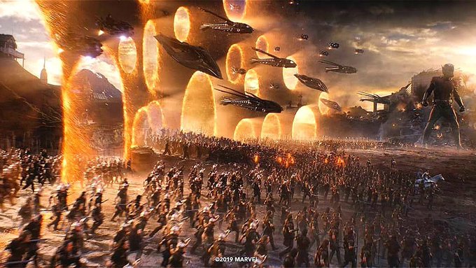 A dramatic Marvel concept art scene showing a massive battle with crowds of warriors facing glowing portals and alien spacecraft, copyrighted 2019 Marvel.