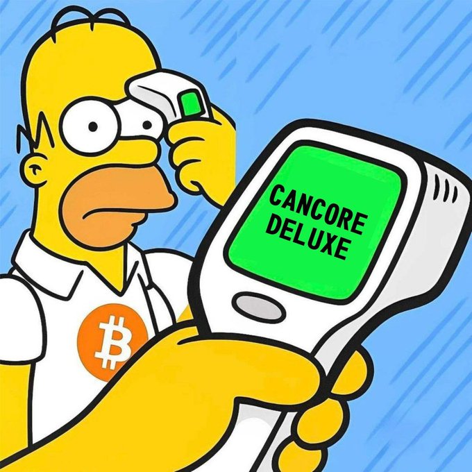 A cartoon character resembling Homer Simpson holds a white device displaying "CANCORE DELUXE" on its green screen, while wearing a Bitcoin logo shirt, visually representing early adopters testing the CanCore platform during its Genesis phase as mentioned in the post.