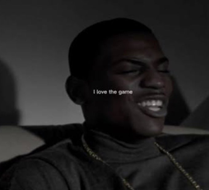 A grayscale image features a smiling Black man with his head turned to the side, overlaid with the text 'I love the game'.