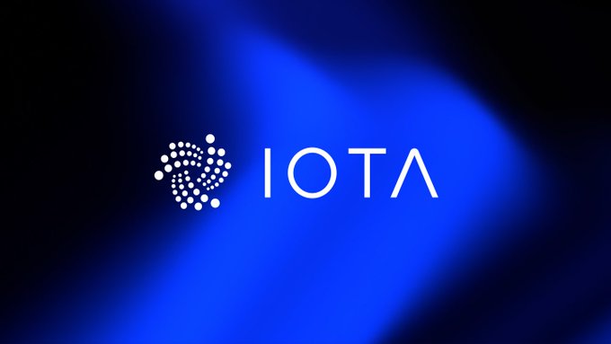The IOTA cryptocurrency logo displayed against a vibrant blue and black gradient background.
