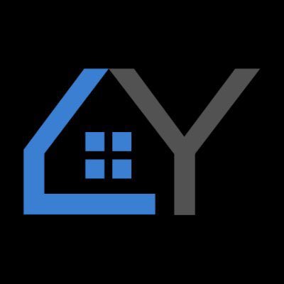 The image displays a logo for "AY" (YourPlace Inc.), featuring a stylized blue house outline with a four-pane window integrated into the letter "A," alongside a gray "Y" against a black background. It visually represents the brand identity of @YourPlace_Inc, an open-source, blockchain-powered social network emphasizing uncensorable, user-owned content and decentralization.