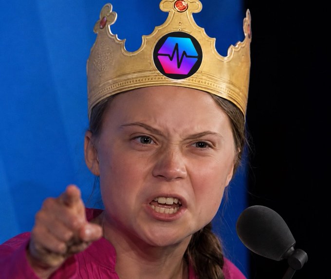 Greta Thunberg wears a golden crown with a heart-rate logo on her forehead, pointing angrily at the camera while shouting into a microphone. The satirical image mocks her activism with the caption "What's the best caption for this? Drop it below," inviting viewers to joke about her perceived self-appointed moral authority.