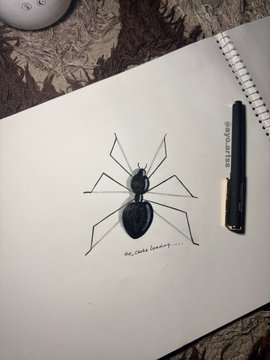 A sketch of a black ant is drawn in a spiral notebook, with a small handwritten caption beneath it, and a STAEDTLER pencil rests to the right—tying into the morning post featuring @ant_clubz.