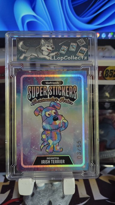 A holographic Veefriends Super Stickers trading card featuring a rainbow Irish Terrier dog, numbered 03/55, displayed in a protective case with an 'LLopCollectz' sticker on top.