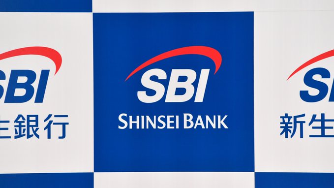 The image features a banner for Shinsei Bank showcasing its name prominently at the top. The text below reads "BREAKING NEWS: ¥2.7T SBI Shinsei Bank of Japan to reward depositors with XRP based on their balance", indicating that the bank is promoting a new cryptocurrency reward system called XRP. The post also mentions that the banks are offering 20% of interest payments as crypto rewards for depositing in the new system.