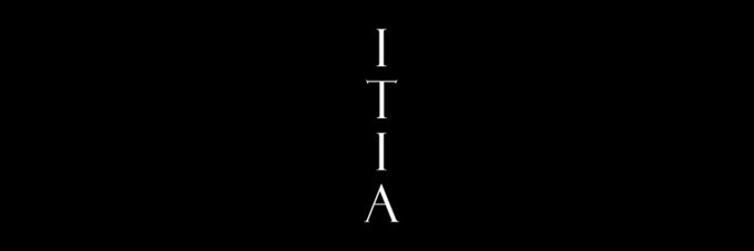 A black screen with the word "ITIA" stacked vertically in white letters.