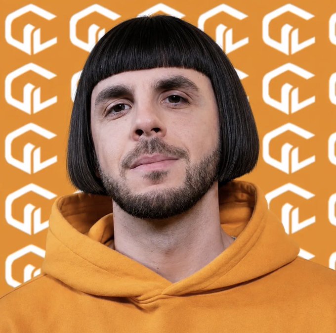 A man with a black bowl-cut hairstyle and a mustache wears a mustard-yellow hoodie, standing in front of an orange backdrop patterned with a white "G" logo. The image pairs with a tweet teasing an upcoming reveal of a full NFT collection, lamenting that the entire @FunkariNft community has been excluded from the whitelist.