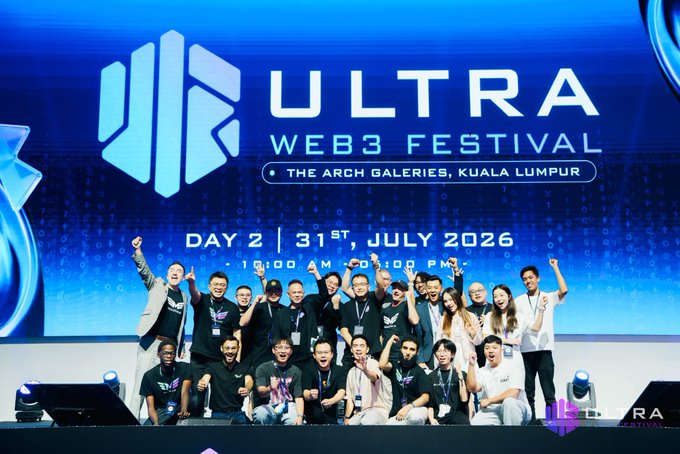 The image shows a group of enthusiastic participants and organizers posing together on stage at the ULTRA Web3 Festival, held at The Arch Galleries in Kuala Lumpur on Day 2 (July 31st, 2026), capturing the celebratory wrap of the two-day event.