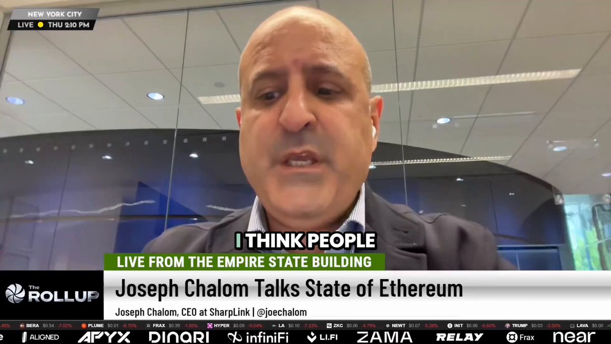 The image shows a man wearing a suit, possibly Joseph Chlambert, who appears to be talking about the Empire State Building. The caption of the image reads "Is the $ETH  $AMZN comparison fair???". This suggests that there might be some debate or discussion surrounding the comparison between the value of the Empire State Building and the price of Etherium on the stock market.
