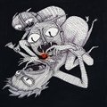 A small black-and-white sketch of a quirky, cartoonish creature with large eyes and antennae on a dark background.