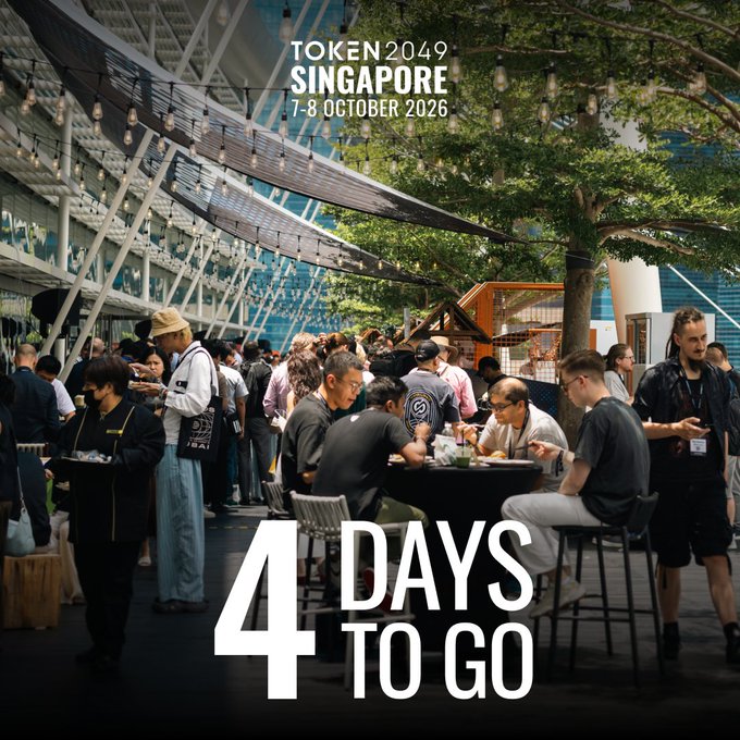 A promotional image for Token2049 Singapore (7-8 October 2026) showing an indoor networking event with attendees gathered around tables under string lights, with bold text reading "4 DAYS TO GO" — aligning with the post's excitement about upcoming meetings, conversations, and connection opportunities at the conference.