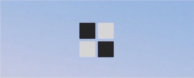A minimalist logo featuring four black and white squares arranged in a 2x2 grid pattern on a light blue gradient background.