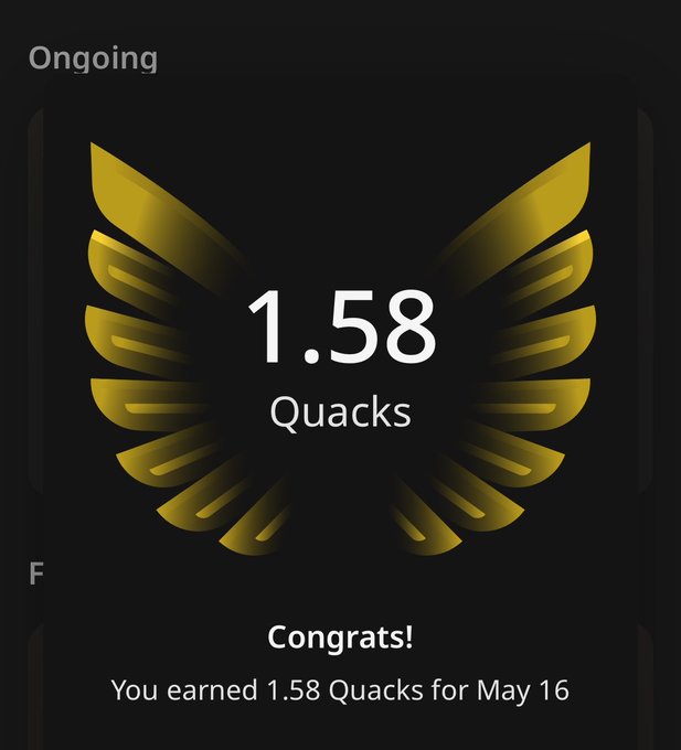 The image features a gold-colored logo with the text "Ongoing" at the top of the frame. Below this, there are two golden wings that appear to be made up of quacks. The wings are positioned above a scorecard or scoreboard, which displays the number 1,58 and the word "Quacks". This scoreboard is likely used in an online game or competition where players earn points based on their performance.