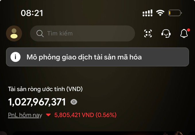 A mobile app interface in Vietnamese showing estimated crypto assets of 1,027,967,371 VND with a P&L decrease of 5,805,421 VND (0.56%) for the day.