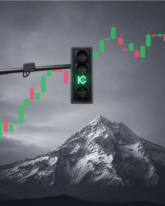 A traffic light displaying a green arrow shines against a grayscale mountain backdrop, overlaid with a green and red candlestick chart trending upward. The image visually reinforces the caption's message, pairing the "go" signal with rising market momentum to suggest confidence while reaching new highs.