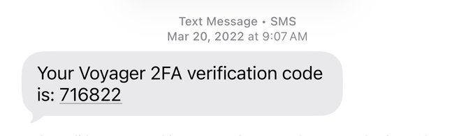 A screenshot of an old text message displaying "Your Voyager 2FA verification code is: 716822," dated March 20, 2022. The image relates to the poster's reflection on past trauma from using Voyager, a now-defunct cryptocurrency exchange known for issues including account access challenges.