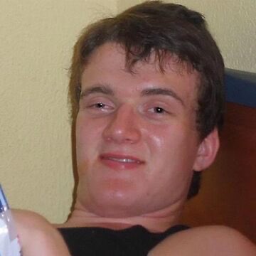 A young man with short brown hair smiles slightly while leaning back, with no visible text or numbers in the image. The caption about Solana demand doesn't appear to have a direct visual connection to the photo, which simply shows a person's face rather than any crypto-related content.