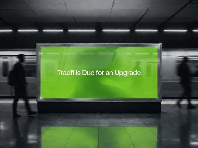 A glowing green billboard in a subway station displays the message "Tradfi Is Due for an Upgrade" as blurred commuters pass by, visually reinforcing the post's message that traditional finance's legacy infrastructure is being replaced by code-driven financial systems.