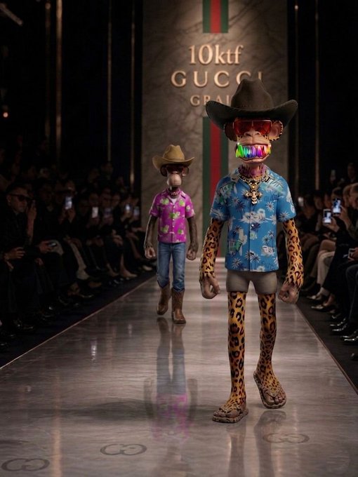 Two models walking a runway at a 10ktf GUCCI fashion show, wearing cowboy hats, Hawaiian shirts, colorful sunglasses, and leopard print pants and accessories.