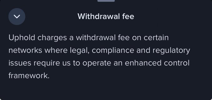 A screenshot of a notice from Uphold stating that they charge a withdrawal fee on certain networks due to "legal, compliance and regulatory issues" that require an "enhanced control framework." This image serves as evidence for a post critiquing Uphold's transparency regarding their withdrawal fee policies for specific assets.