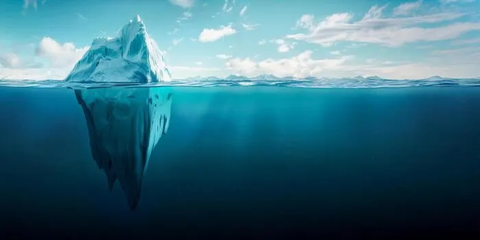 An artistic image of an iceberg with a small portion visible above the water surface and a much larger mass hidden beneath the blue ocean.