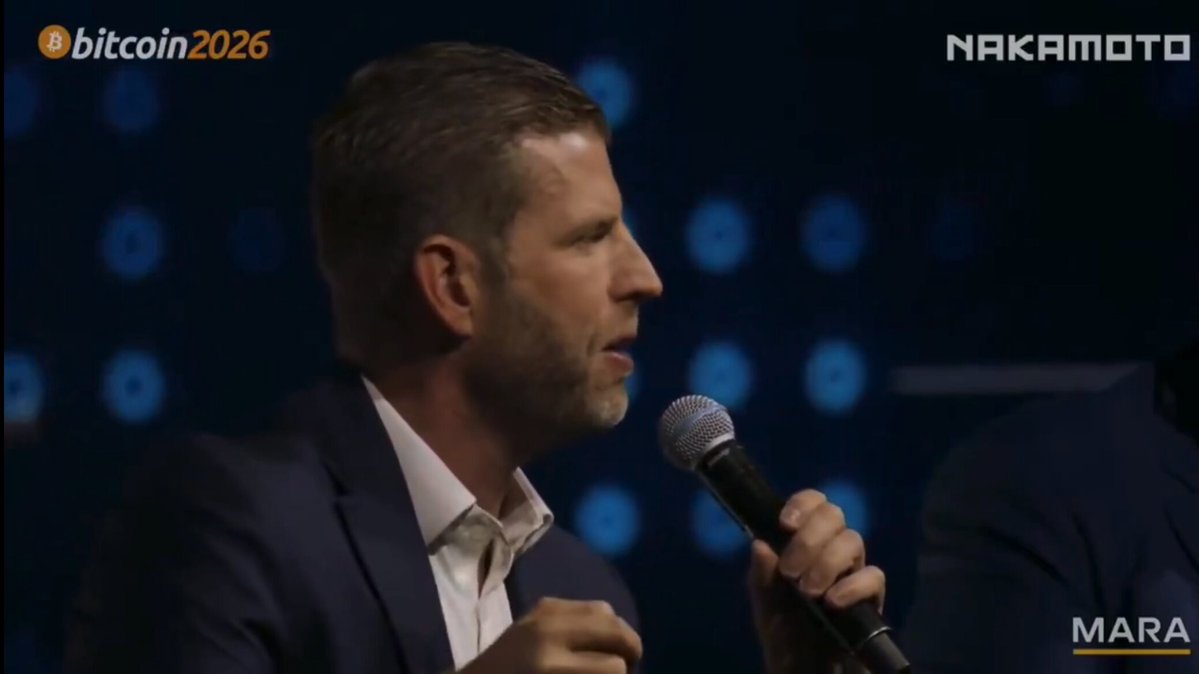 The image features a man wearing a suit, speaking into a microphone at an event. The caption reads "ERIC TRUMP: THIS IS THE GREATEST PERIOD FOR CRYPTO Eric Trump confirmed that the US government will never sell Bitcoin." This statement is made by a prominent figure in the crypto world and emphasizes the importance of Bitcoin during this period.