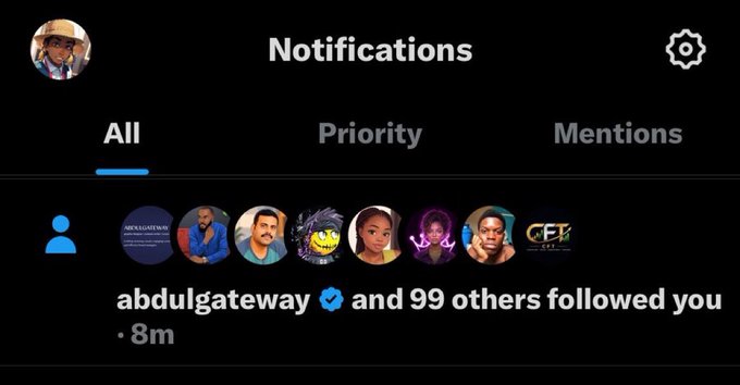 A notifications screen showing that "abdulgateway ✔ and 99 others followed you" 8 minutes ago, celebrating the surge of new followers and community support highlighted in the accompanying post.