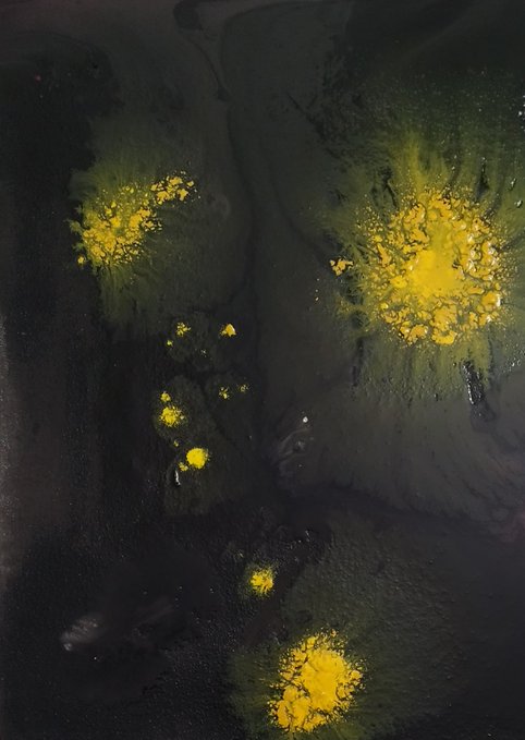 Abstract yellow and black paint splatters glow like scattered suns against a dark, shadowy void, visually echoing the post's metaphor of the "Sun Within" as a vital source of hope and warmth amid surrounding darkness.