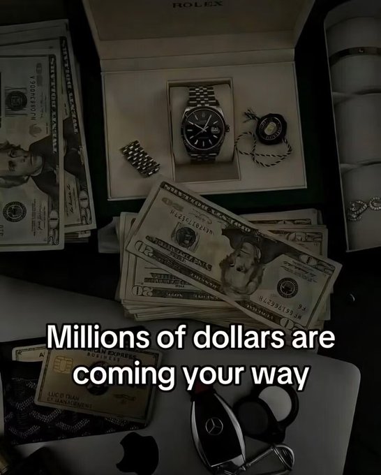 A promotional image showing stacks of U.S. currency, a Rolex watch, gold Amex and Visa cards, a Mercedes key fob, and an iPhone, with the text 'Millions of dollars are coming your way'.