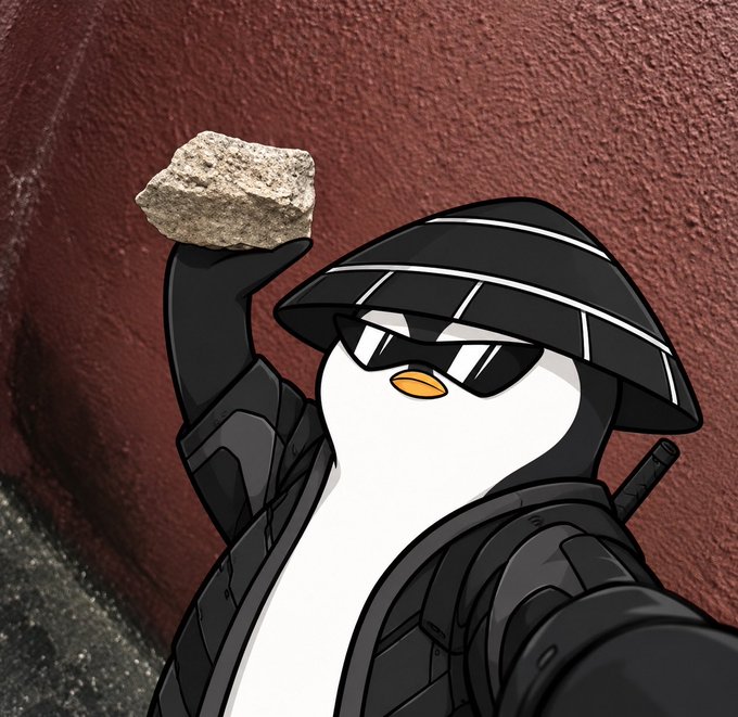 An animated cartoon penguin wearing a black tactical hat, sunglasses, and body armor holds up a gray rock against a textured reddish-brown wall.