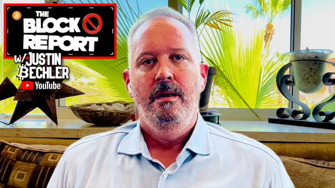 A man with a goatee in a light blue polo shirt on 'THE BLOCK REPORT w/ JUSTIN BECHLER' YouTube show, with tropical plants in the background.