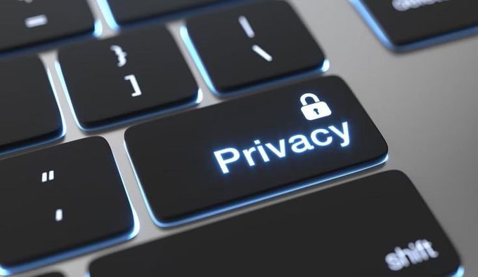A close-up of an illuminated keyboard key displaying the word 'Privacy' with a padlock icon, symbolizing digital security and data protection.