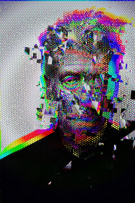 The image features a man's face with a rainbow patterned design, possibly created using dots or small pieces of paper cut into various shapes. The background appears to be white, which contrasts with the colorful design on the face. The caption below the image reads "Defragment Lynch From my Insanity Collection 1/1 - 65 tz now". This suggests that the artist behind this piece has a unique and unconventional style, possibly inspired by surrealism or abstract expressionism.