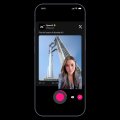 The image shows a smartphone screen displaying a photo of a woman, with a caption that reads "X ADA FITUR BARU WOI!!! Kalian udah cobain blm react to video ini?? Ini fiturnya baru ada di IOS doang katanya jadi buat". The image is accompanied by a pink and black button, which the woman appears to be pressing.