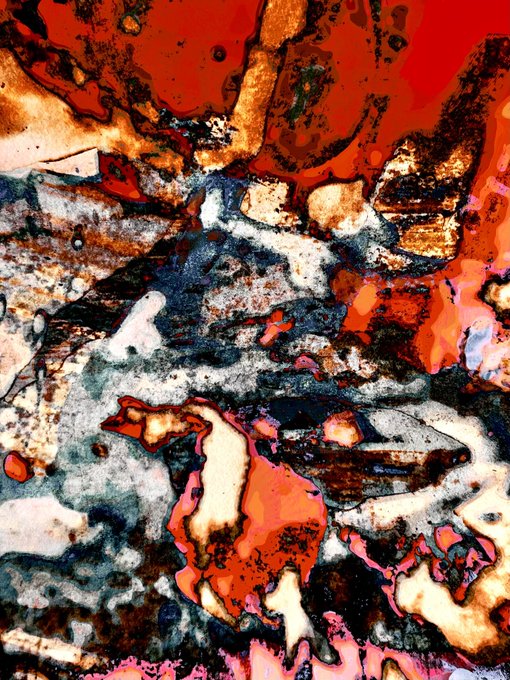 An abstract, heavily textured image with swirling patterns of red, orange, black, white, and blue.