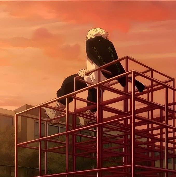 An anime-style illustration of a blonde character in dark clothing sitting on a red metal scaffolding against a warm orange sunset sky.