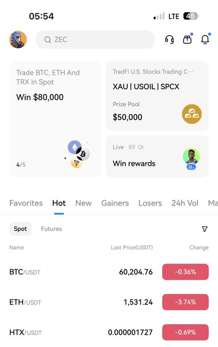 In this image, a screenshot of a mobile phone screen displays the trading platform XTA USOI SPCPX. The phone's app features a list of trades and their corresponding prices for Bitcoin (BTC) and Ether (ETH). It shows that the user has won $80,000 in trade prizes on Litecoin, with several other trades displayed, such as one involving a win of $50,000 on Bitcoin (BTC), a loss of 2 hours on Ether (ETH), and an upswing of 1.61% on another cryptocurrency pair called HXT USDT. Additionally, the app provides information about futures trade opportunities that are favorable to new users, like HXT USDT.