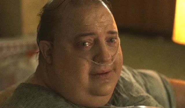 A balding man with a nasal cannula looks emotional, with tears welling in his eyes. The image humorously suggests regret, implying the man quit the stock market to chase crypto riches only to suffer devastating losses.