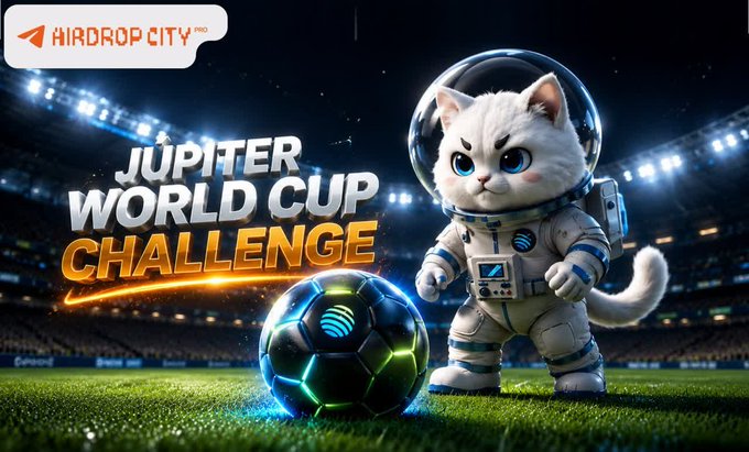 The image features a cartoon cat wearing an astronaut suit, standing next to a soccer ball. The background of the image shows a stadium with lights shining brightly, indicating that this scene takes place during a nighttime event or game. The caption below the image reads "Jupiter World Cup Challenge" and is written in white text against a black background.